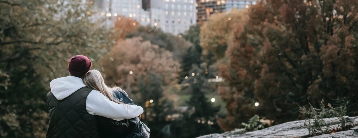 a couple hugging and watching the skyline