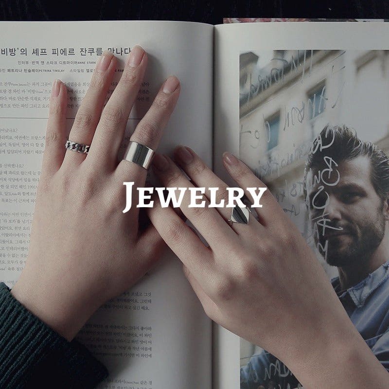 a hand with personalized jewelry on it